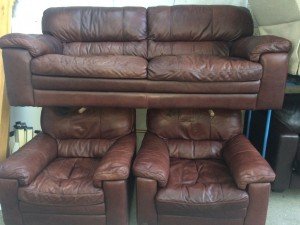 Brown leather upholstered two seater sofa