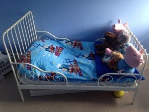 Toddler bed that extends to single bed with toddler mattress.
