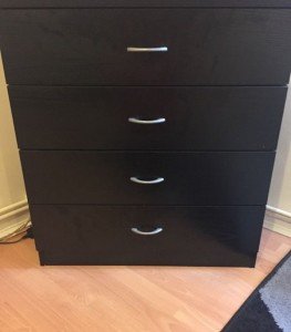 Black 4 draw chest of draws with silver handles.
