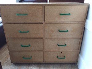 An 8-drawer Chest of Drawers with metal rails and plastic handles.
