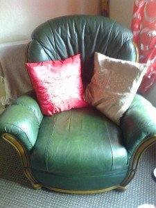 Green leather 3 piece suite.