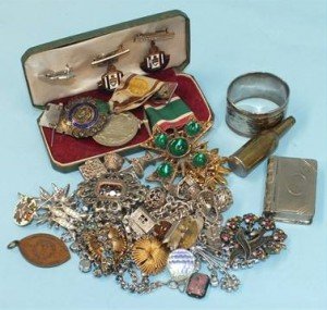 Two silver charm bracelets, a Women's Voluntary Service Medal, an RAOB silver medal, costume jewellery and other items.