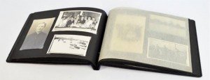An early to mid 20th century black bound photograph/postcard album containing a quantity of photographs and postcards relating to life on board ships, passengers and landmarks.