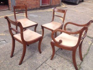 four mahogany curved base chairs