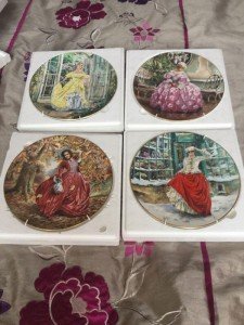 four Royal Doulton wall plates