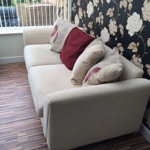 cream upholstered sofa