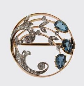 gold circular brooch