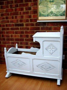 carved rocking crib
