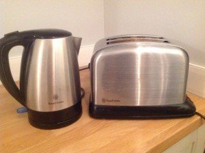 stainless steel and black kettle