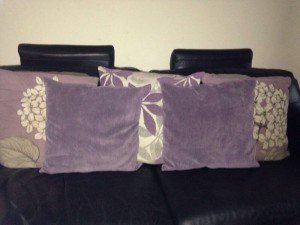 five lilac sofa cushions